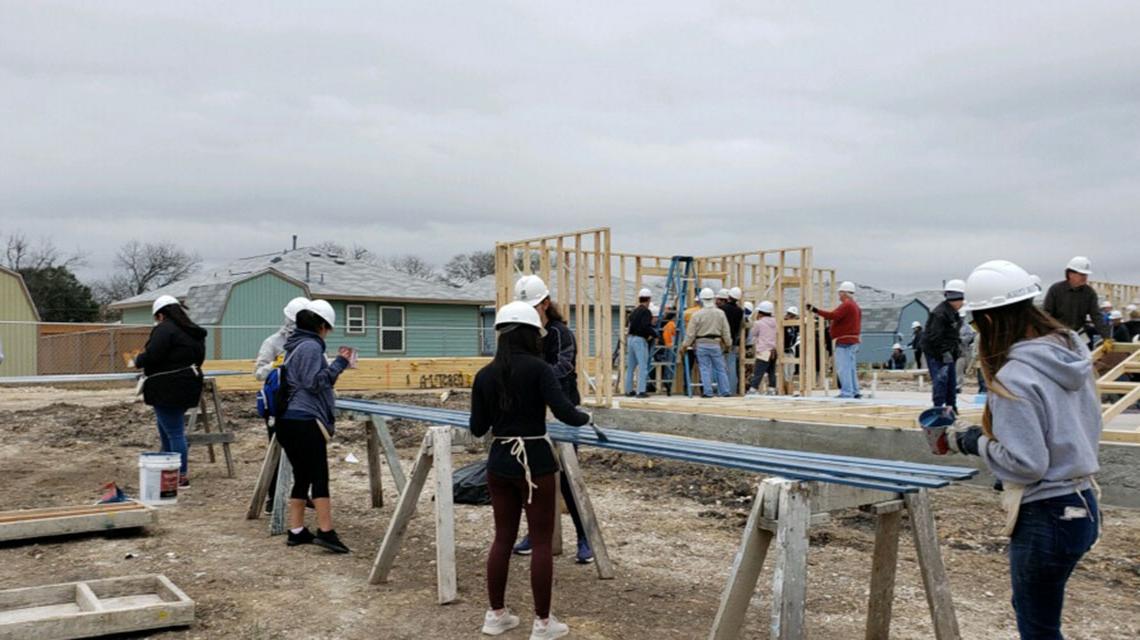 Students working on a construction site